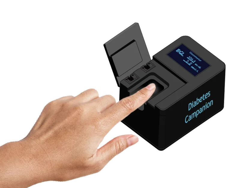 Diabetes Companion prototype: a compact black device with a fingertip sensor and a small display showing a glucose reading